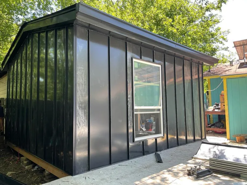 Black standing seam metal wall panels for Roof Inspection in Wyldwood